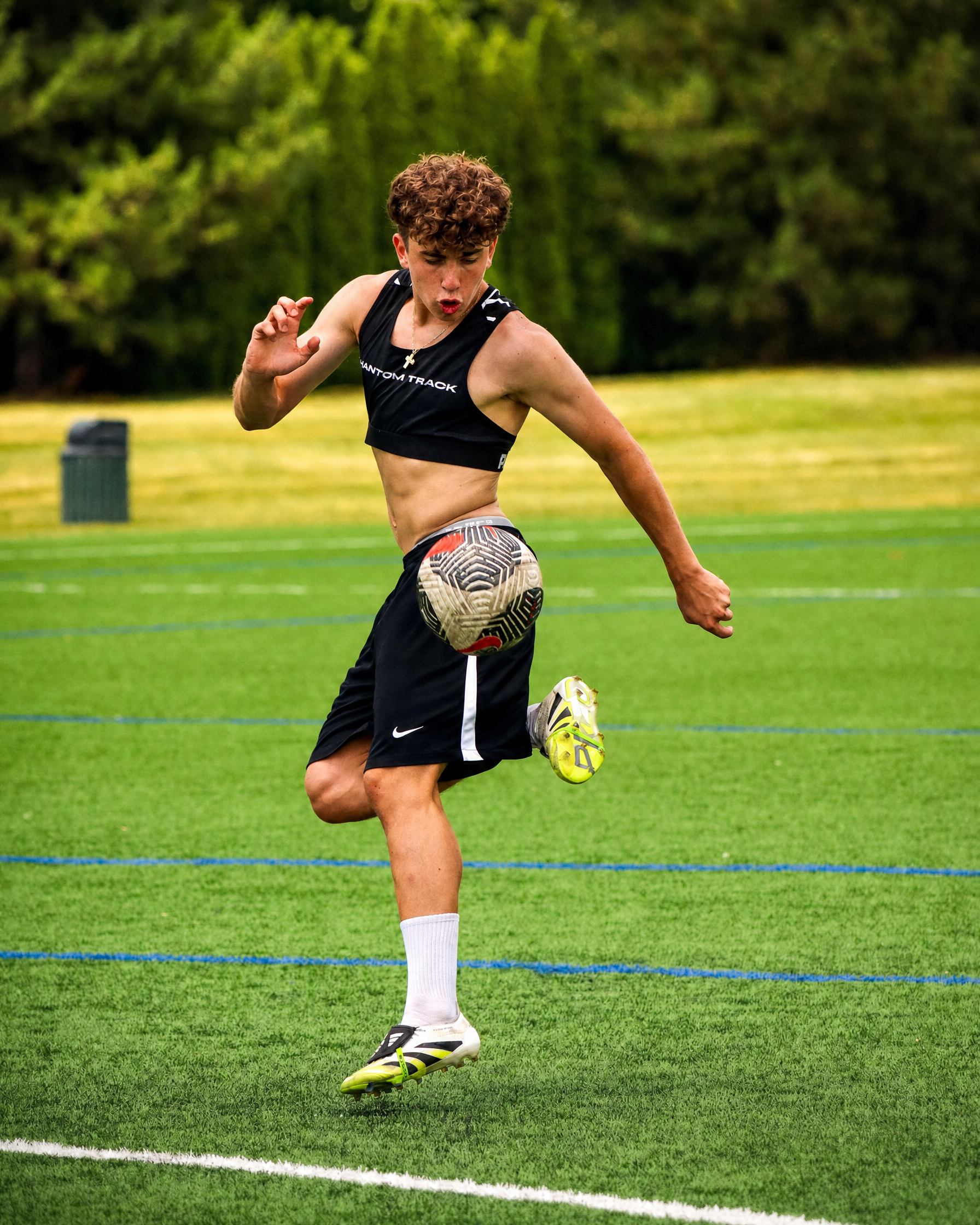 Athlete juggling in the Phantom Vest — chest branding visible
